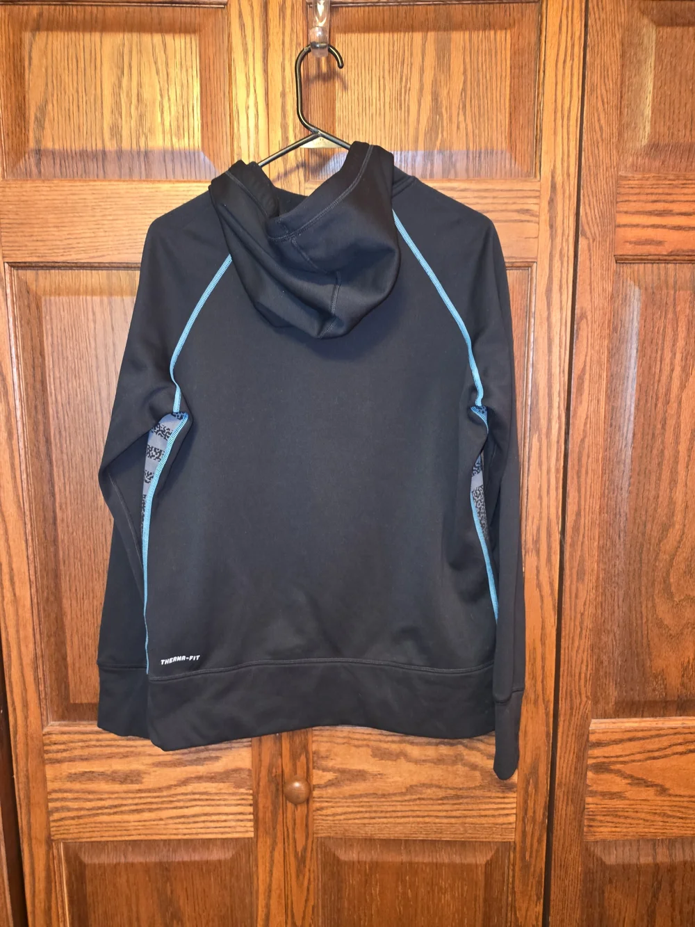 Nike Black Hoodie with Teal Accents and Striped Front